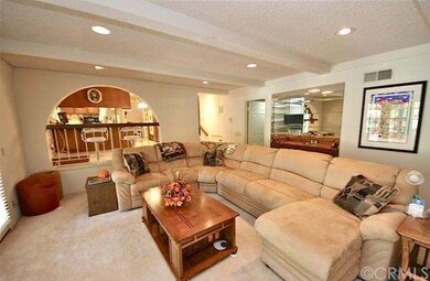 Huge family room with wet bar, fireplace & beamed 