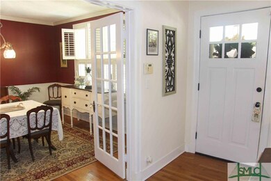 View to the front door and dining room.