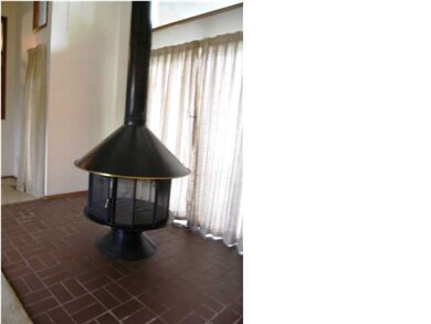 A close-up of the wood burning fireplace.
