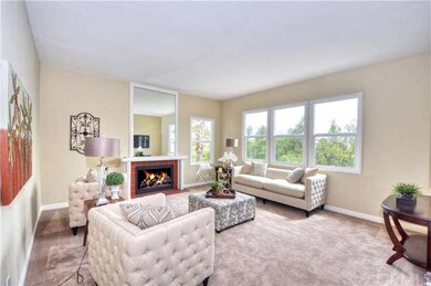 Living room has new windows with city lights and t