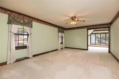 Oversized Master Bedroom with custom window treatm
