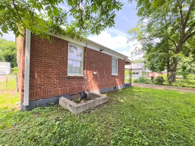 View of side of home featuring brick siding