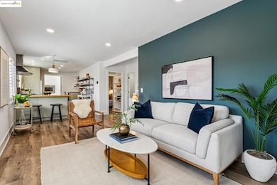 Living area with wood finished floors and recessed lighting