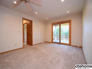 Open to the Kitchen. This could be a dining Room. Newer Sliding doors opens to the large covered porch.