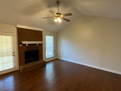 Unfurnished living room with lofted ceiling, dark 