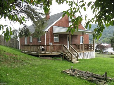 Covered Porch with Deck to Rear of House