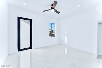 Unfurnished room featuring ceiling fan