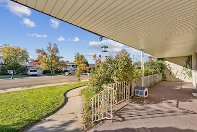 Porch featuring a yard