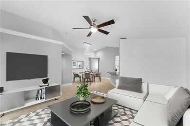 Living room featuring vaulted ceiling and ceiling 