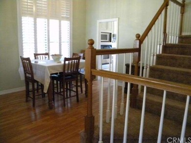 Dining room w/ wood laminate flooring.