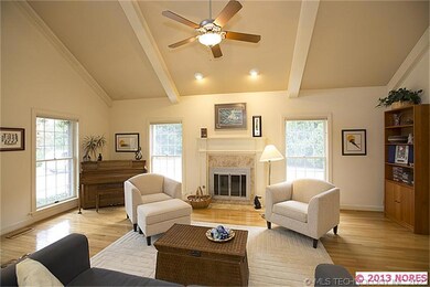 A gas log or wood burning fireplace provides a foc