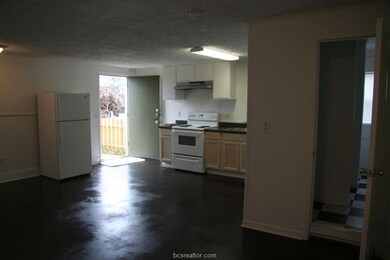 Kitchen featuring white appliances, under cabinet