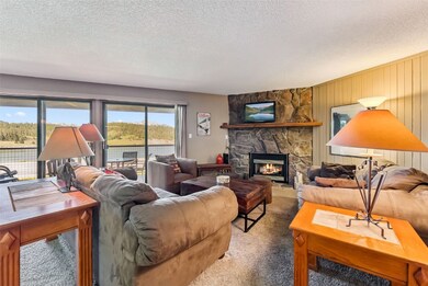 Carpeted great room featuring a wall of windows!