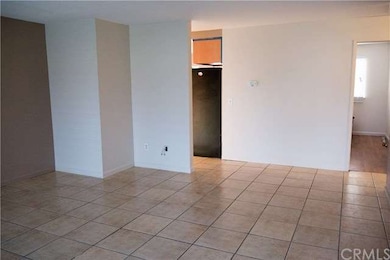 Living room leads to kitchen and Master on the lef
