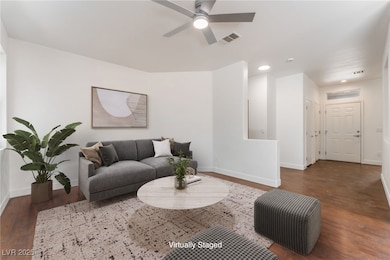 Living area with wood finished floors, baseboards,