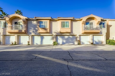 Mediterranean / spanish house featuring a balcony, stucco siding, concrete driveway, and a tiled roof