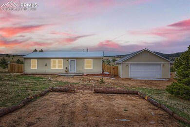 Ranch-style home with fence and a garage