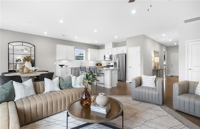Kitchen with stainless steel appliances, open floo