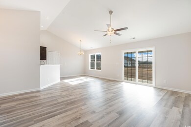 Unfurnished living room with a ceiling fan, a chandelier, light wood-style flooring, recessed lighting, and high vaulted ceiling