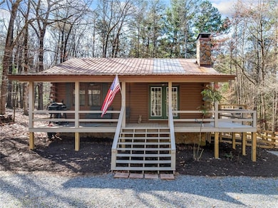 View of front facade featuring french doors, a chi