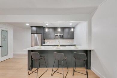 Kitchen featuring tasteful backsplash, appliances 