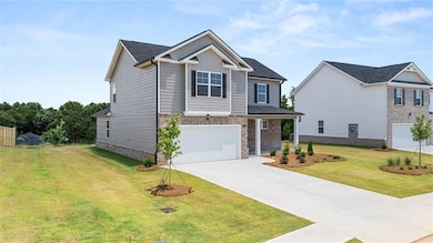 Craftsman-style house featuring a garage and a fro