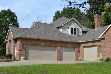 3 car attached garage, plus a 1 car off the in law