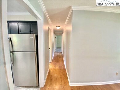 Hallway from the living rooms leads to the bedroom