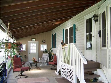 Exterior Front carport & enclosed porch