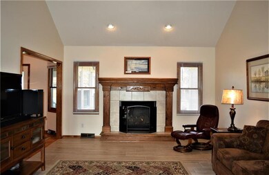 Roomy living room with vaulted ceiling adding to t