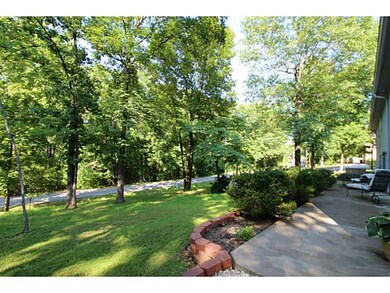 Exterior Back/Side. Lower Level Patio.  Private area for In-Laws Qtrs.