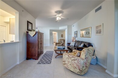 Tiled living room with ceiling fan