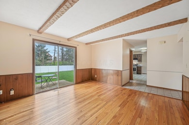 Bright family room open to back yard