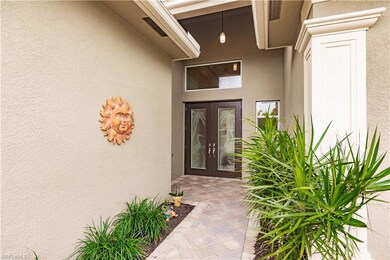 The French double door entry has been tricked up with SW FL themed etched glass that brings light into the wide foyer and through to the rest of the home.  Be sure to check out the natural gas fed whole house generator (a $20-25k upgrade) that will p
