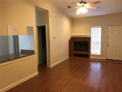 Unfurnished living room featuring baseboards, vis