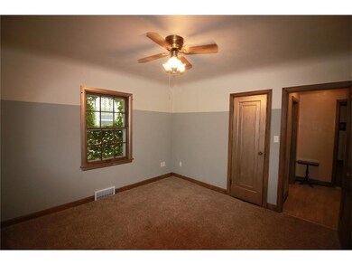2nd bedroom on main level with coved ceiling.