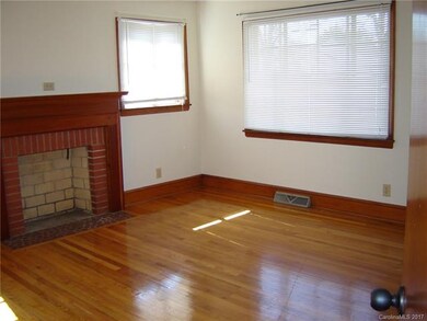 Living room with beautiful, original wood floors.