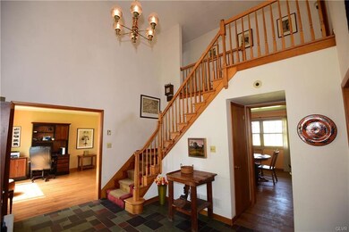 SPACIOUS FOYER WITH SLATE FLOORING