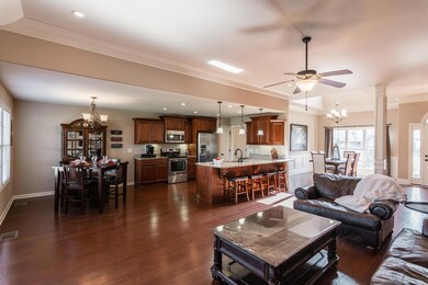 Here's another look at this great layout! Notice the beautiful hardwood flooring throughout the living and dining spaces. 
