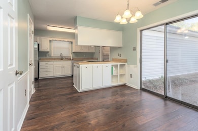 breakfast area features dark hardwood / wood-style