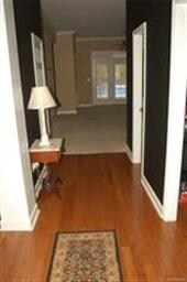 The inviting entryway has beautiful hardwood floor