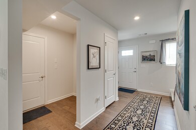 Foyer showing the mudroom coming in from 2 car garage