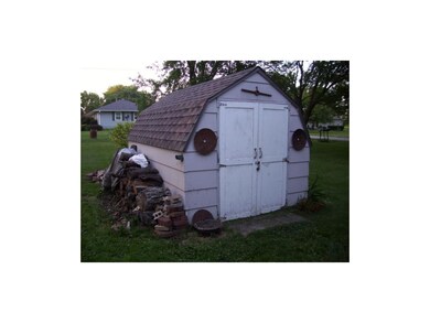 Storage shed behind house.