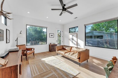 Living area featuring light wood-type flooring, c