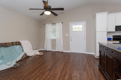 Interior space featuring dark hardwood / wood-styl