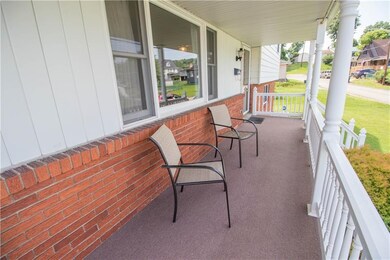 THIS CHARMING FRONT PORCH WILL BECKON YOU TO SIT, 