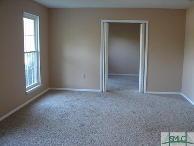Formal living room leading to dining room