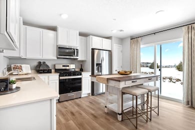 Lots of cabinets and pantry space will ensure that you have plenty of storage options. Photo is of model home. Colors and options may vary. Ask Sales Agent for details.