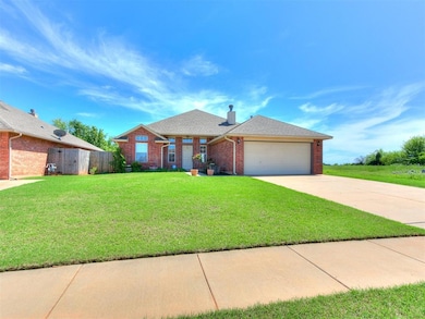 Single story home featuring fence, brick siding, a