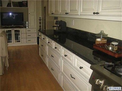 Kitchen with granite counters, custom cabinetry
